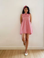 Candy stripe mini dress with criss-cross front.