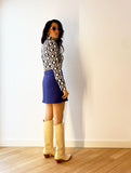 1960s inspired purple miniskirt with boots, back.