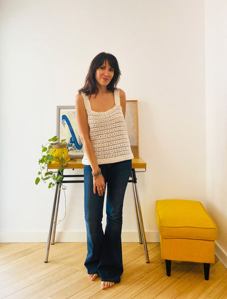 Cream colored crotched tank top.